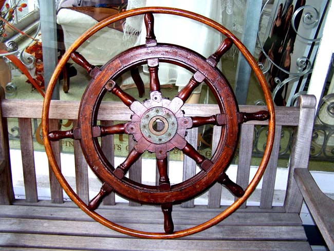 A Nice late 19th century Ships' Wheel with outer wooden rim.